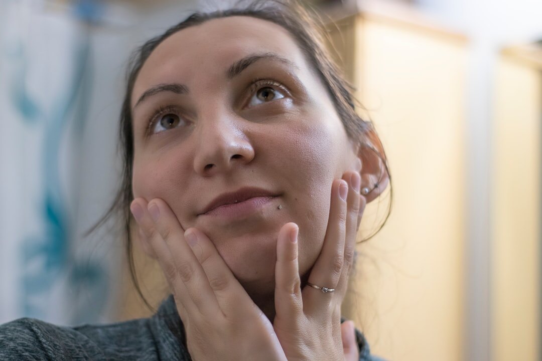 woman doing facial massage