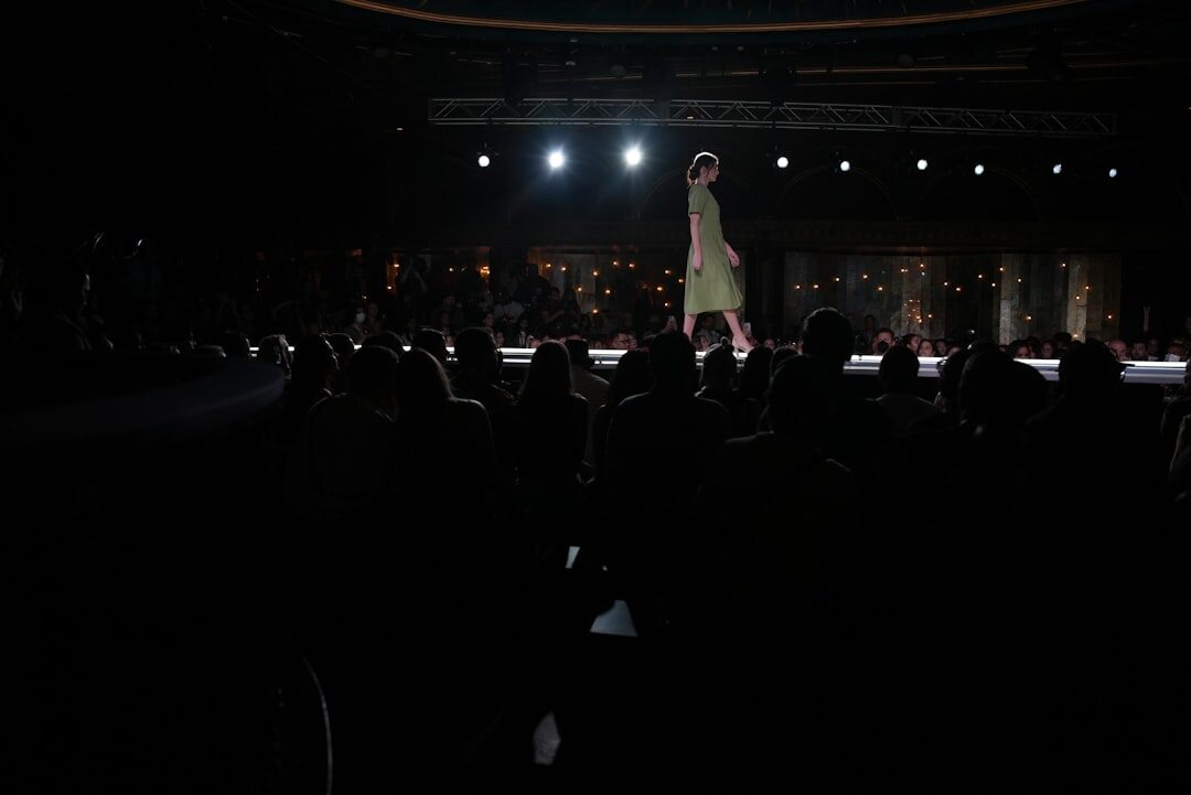 Fashion runway show with dramatic lighting