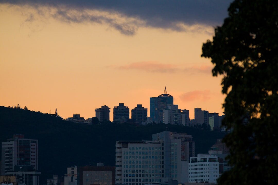 City skyline at dusk with warm amber light